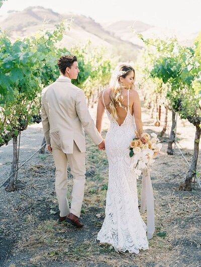 bride and groom in vineyards