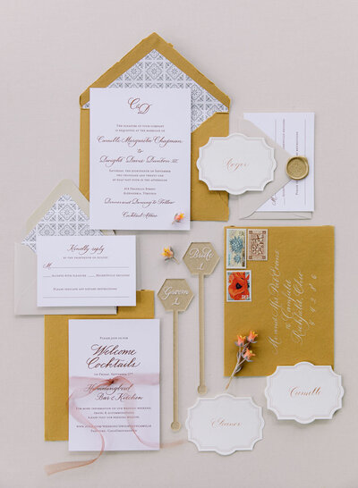 Saffron yellow, white and taupe wedding invitation suite featuring copper foil printing and handwritten calligraphy script and envelope mailing address calligraphy