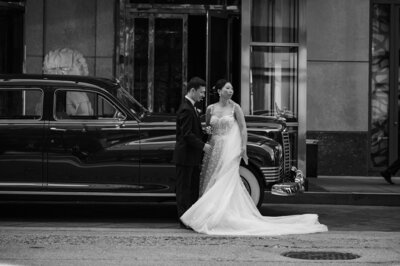 Bride and groom with old car at The Peninsula Hotel in Chicago