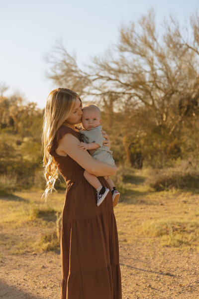 mother holds her son in arizona desert