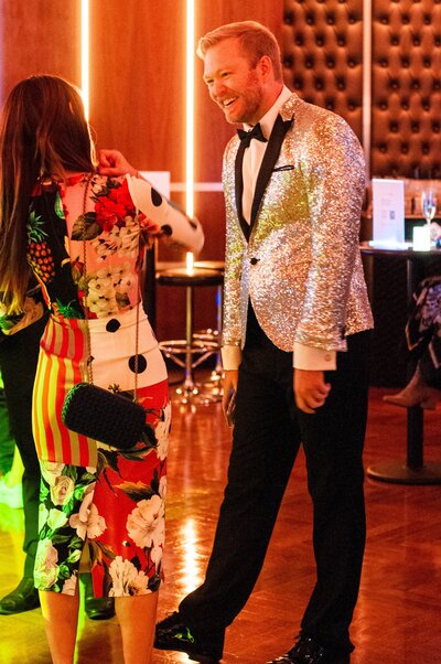 Guests mingling at an upscale fundraising gala at 48 Wall in Manhattan