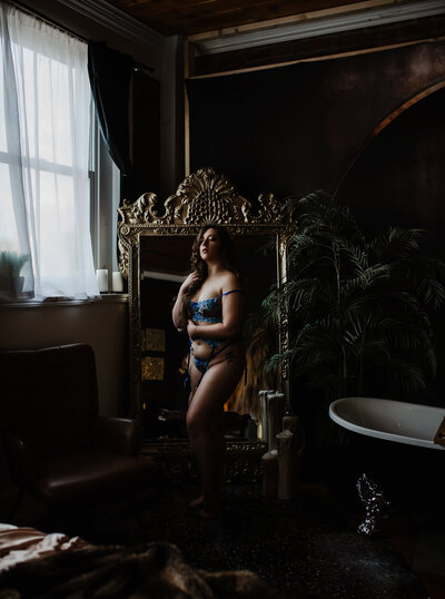A woman laying on a bed. 