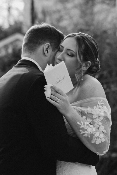 bride hugs groom during private vows