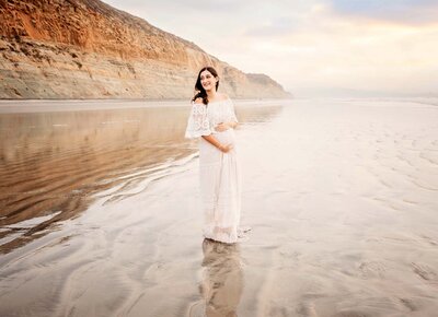 Beautiful pregnant mama posing during her La Jolla maternity photography session at Torrey Pines State Beach