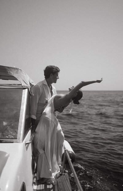 Elegant and luxury engagement session by Staci Brucks Photography featuring newly engaged couple on luxury yacht at sunset