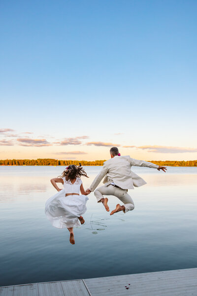 Bride and groom jumping into the lake - Park Rapids, Minnesota