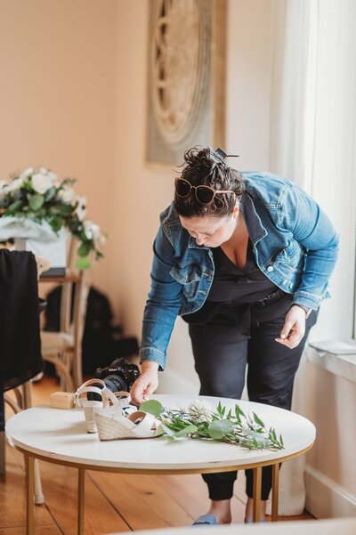 wedding photographer setting up a flatlay of details