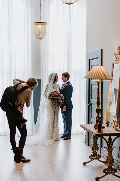 Wedding Photographer photographing Bride and Groom wedding day