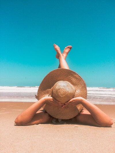 women relaxing on beach