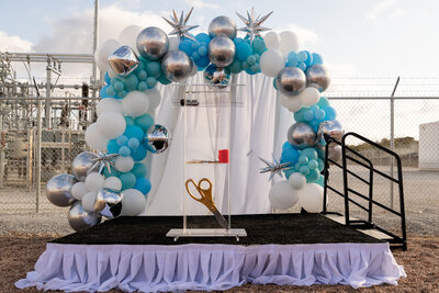 grand opening ribbon cutting stage  designed by a corporate event planner in Austin