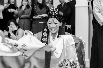 Black and white image of woman in traditional Asian wedding garb