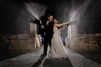 Bride and groom doing a Champagne spray at Barn on Merry Hill in Nottingham NH
