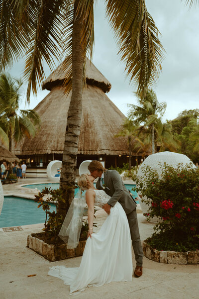 couple dipping and kissing