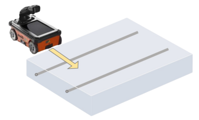 A handheld GPR scanner passing over a concrete surface.