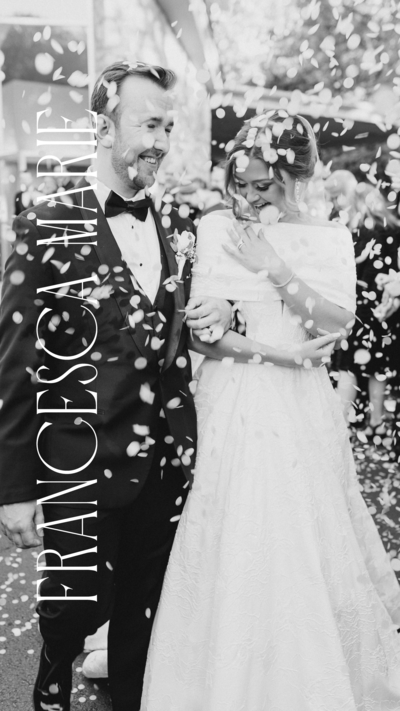 Francesca Marie Photography logo on a black and white photo of a bride and groom walking through confetti