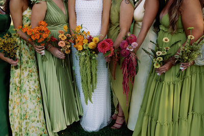 Green bridesmaids dresses with vibrant florals