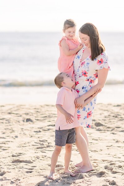 Erin laughing on the beach with her kiddos