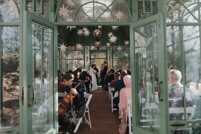 An intimate wedding at the Denver Botanic Gardens in the Woodland Moasic Solarium.