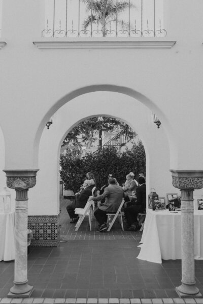the view of guests at a wedding ceremony in black and white