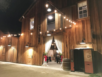 vintage photo booth outside of barn