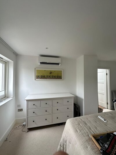 Living room in Dublin featuring a sleek, energy-efficient air conditioning unit installed by Dublin Air.