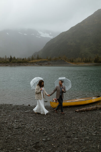 bride and groom with canoe