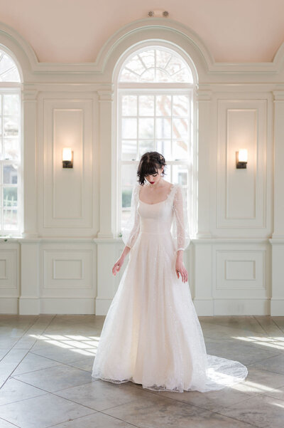 Link to more photos and details about the Gene long-sleeve a-line wedding dress style by Charleston bridal designer Edith Elan.