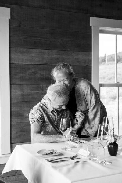 A sweet embrace between wedding guests at a private estate in Cape Breton. 