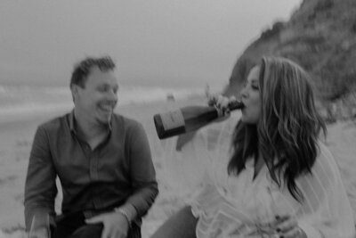 couple drinking on the beach