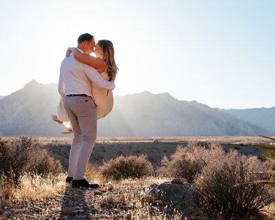couple stares into each others eyes during an engagement session at mount charleston just. outside of Las Vegas, NV