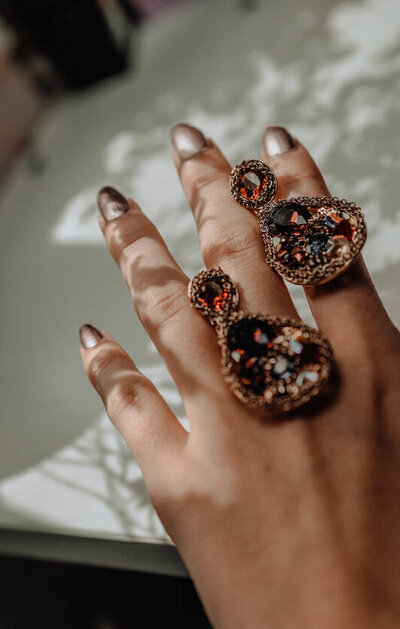 woman holding pretty rings