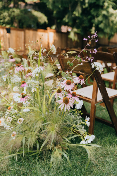 wildflowers behind a row of chairs