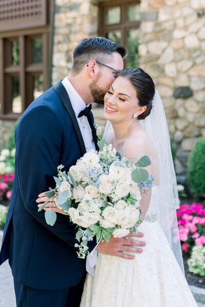 bride and groom hugging