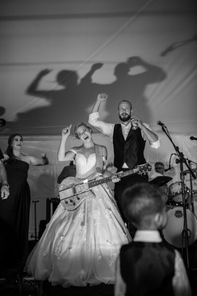 bride and groom having fun at reception