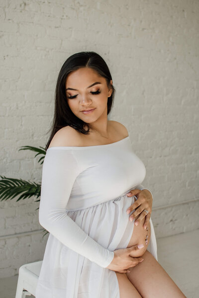 expecting mom in a white dress