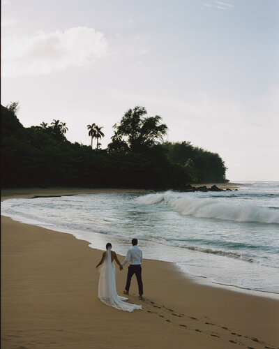 Bride and groom at Tunnels Beach in Kauai