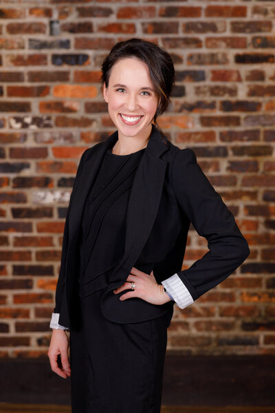 wedding planner in Tennessee standing in front of a brick wall