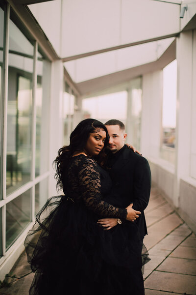 Man and woman pose for MMOCA engagement photos by O & B Photo Co