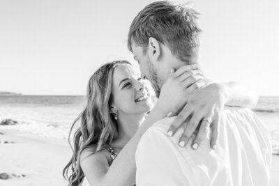 Engagement photos at the beach with the couple looking into each others eyes. Taken at Port Willunga, South Australia but Canberra Wedding Photographer, Acacia & Grace