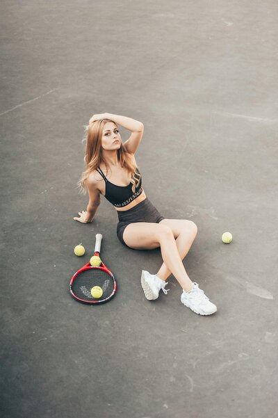 Woman with a tennis racket at Aspria’s premium fitness center, highlighting active lifestyle and sports facilities, captured by Muse Studio for social media branding.