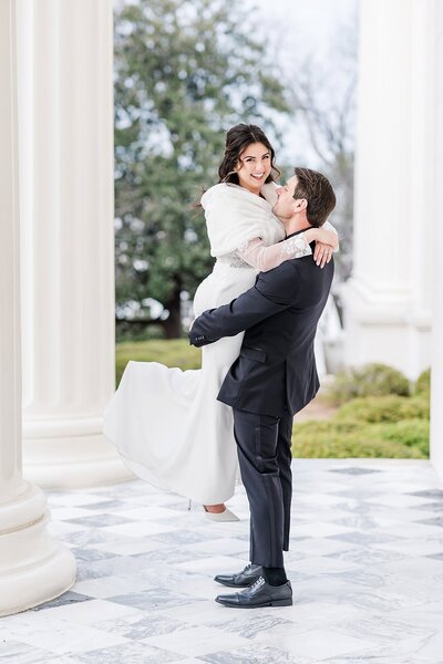 Groom lifting Bride by Auburn AL Wedding Photographer Amanda Horne