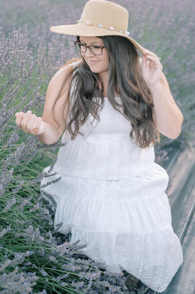 wedding photographer sitting while holding a film camera