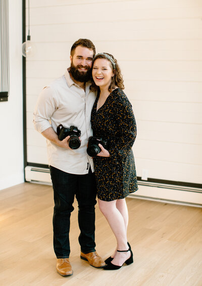 Couple with professional cameras