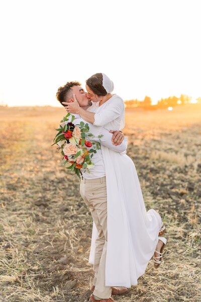 Bride & Groom kiss in the sunset - Fall Wedding