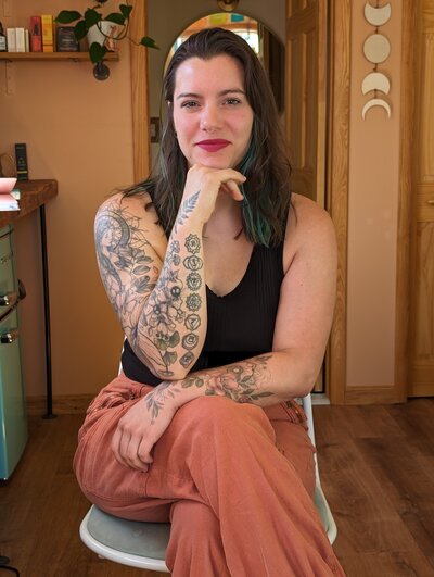 Julie Pokorny, craniosacral therapist in Baltimore Maryland looking at the camera with confidence and joy. 