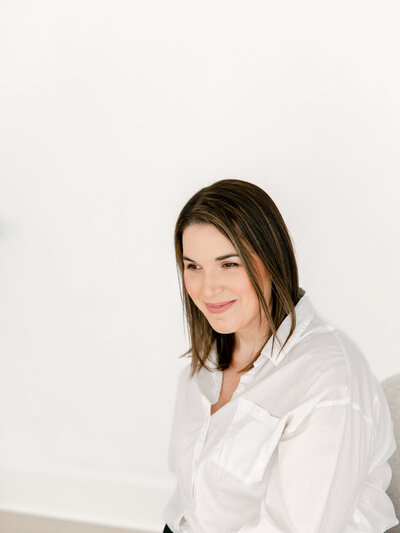 angle view of a woman sitting during a headshot and branding photoshoot