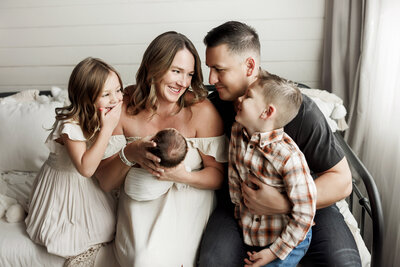 Adorable Colorado family looking at their brand new baby boy
