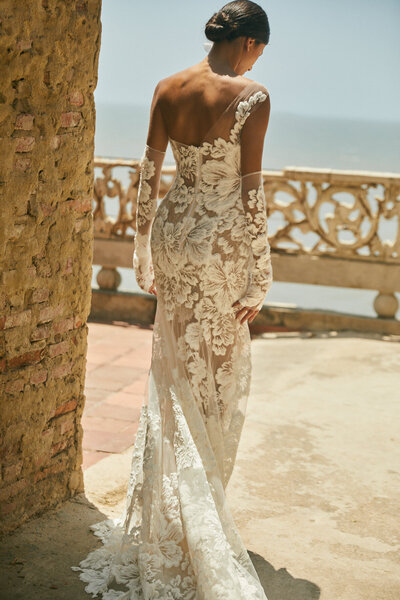 bride wearing off the shoulder white lace wedding dress