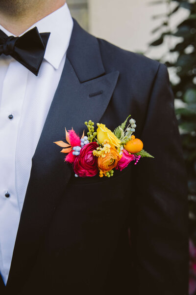 Yellow pink and blush groom boutonniere