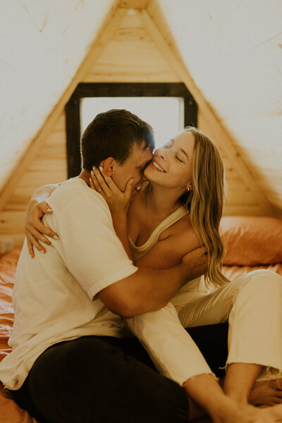 Couple embracing in Glacier National Park Cabin